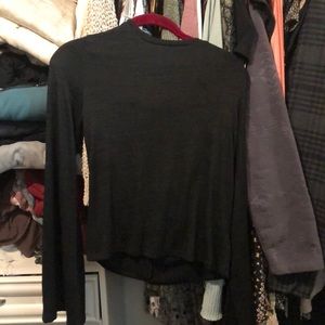 Black dress shirt that is comfy and soft. Cute bow in the back!